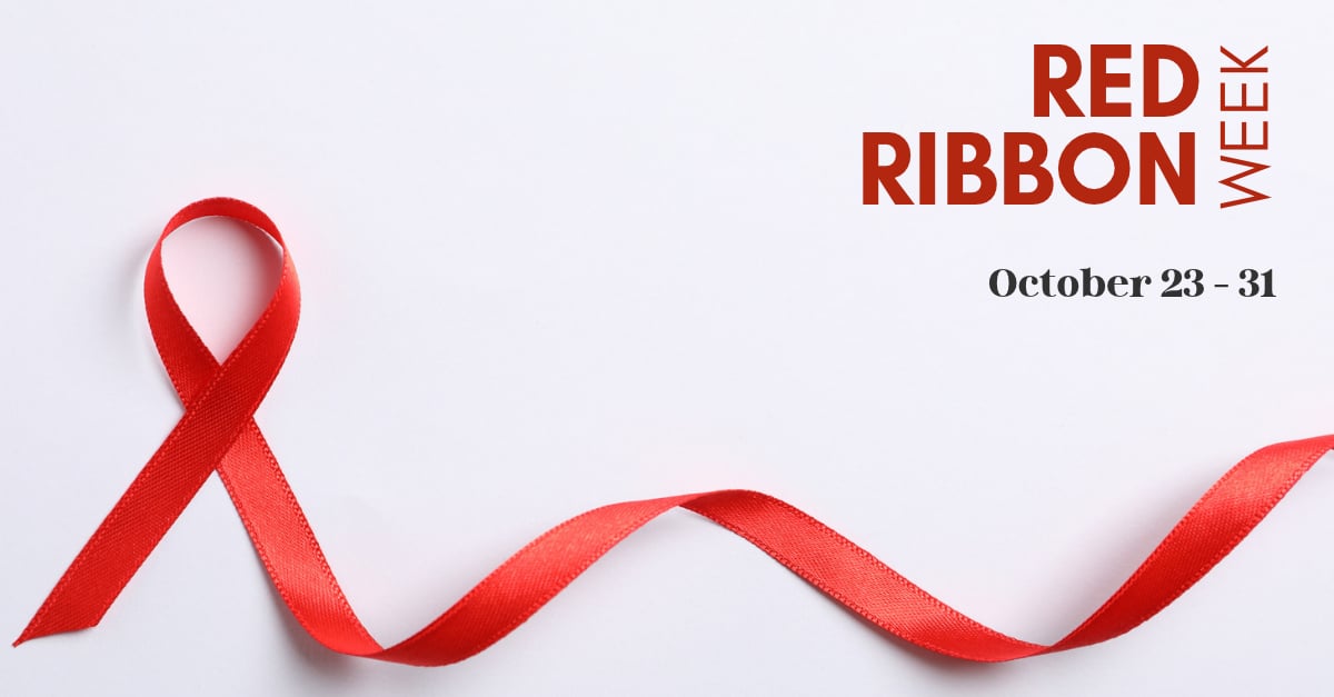 Red awareness ribbon curled on a white background with text announcing Red Ribbon Week from October 23 to 31.